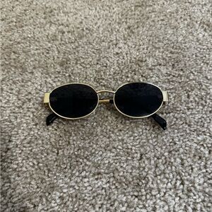 Gold and Black Oval Sunglasses